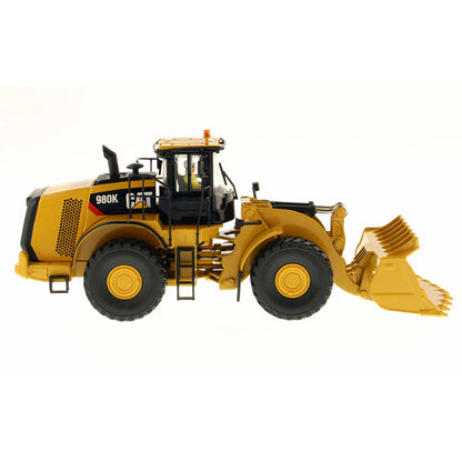 Model of a Caterpillar 980K Wheel Loader with a Rock Configuration on a White Background