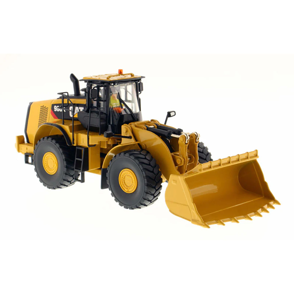 Model of a Caterpillar 980K Wheel Loader with a Rock Configuration on a White Background