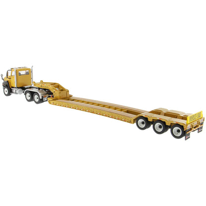 Model of a yellow low-bed truck on a white background