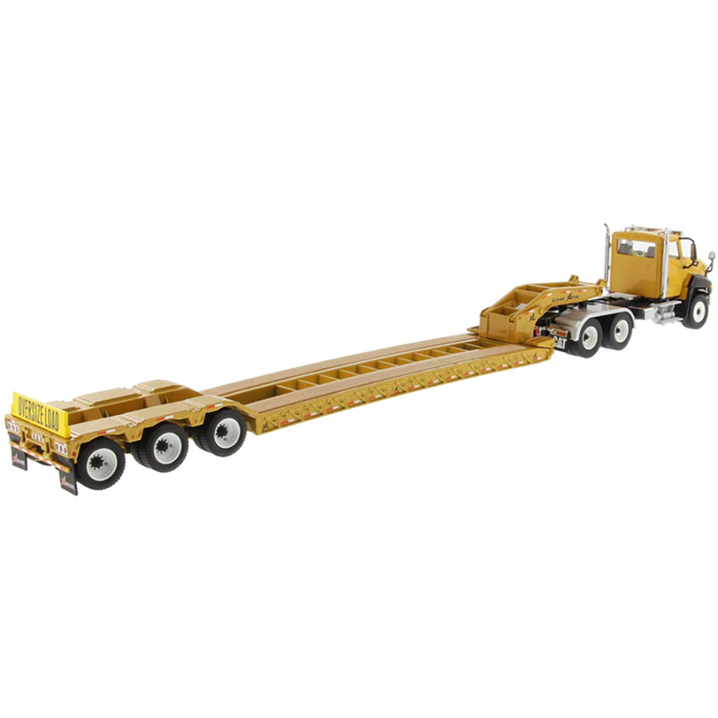 Model of a yellow low-bed truck on a white background