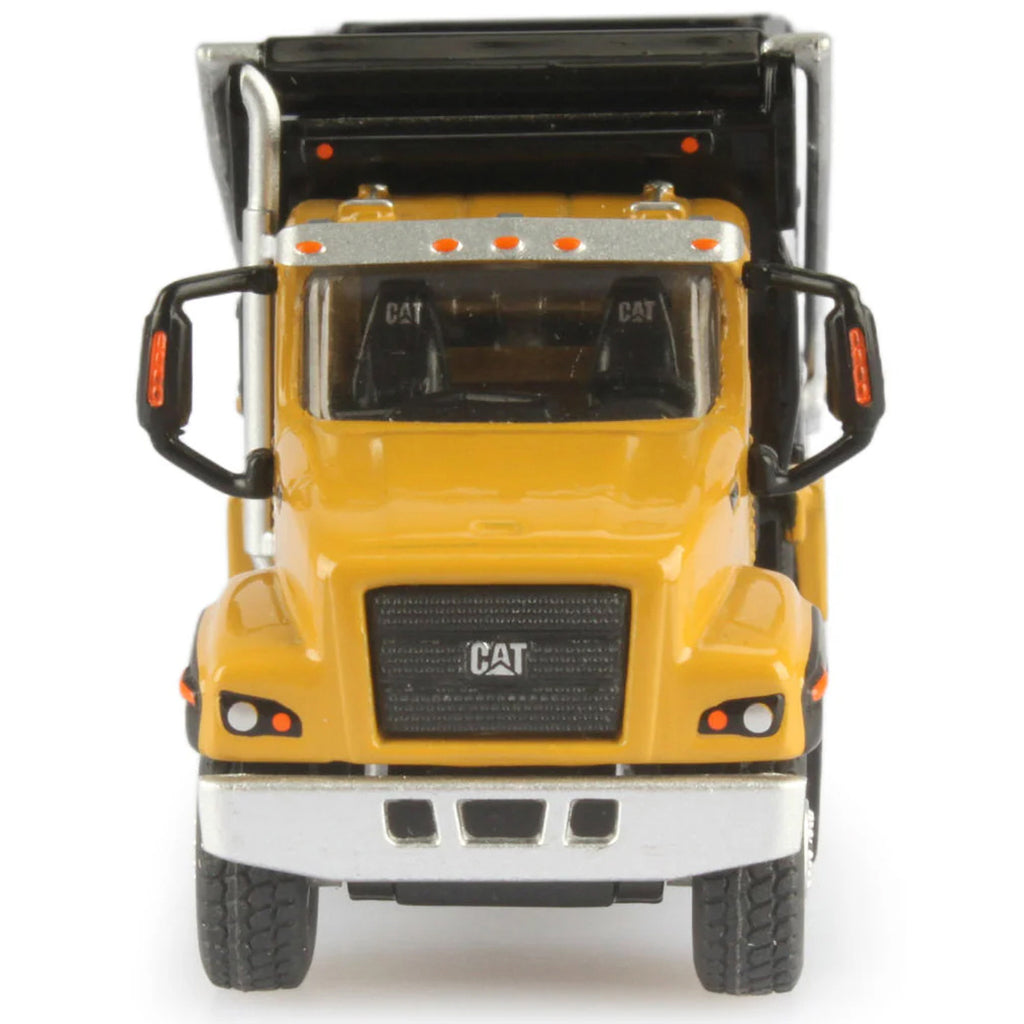Model of a yellow dump truck with open back on a white background