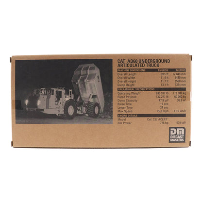Cardboard box packaging for a model CAT AD60 underground articulated truck with specifications.