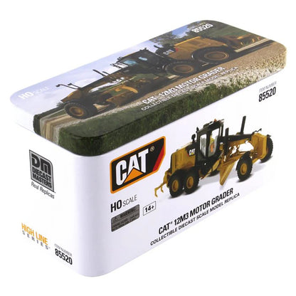 Model of a Caterpillar 12M3 Road Grader Construction Vehicle in Tin Box Packaging on a White Background