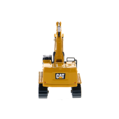 A yellow and black CAT toy excavator with a black bucket and tracks, shown on a clean white background.