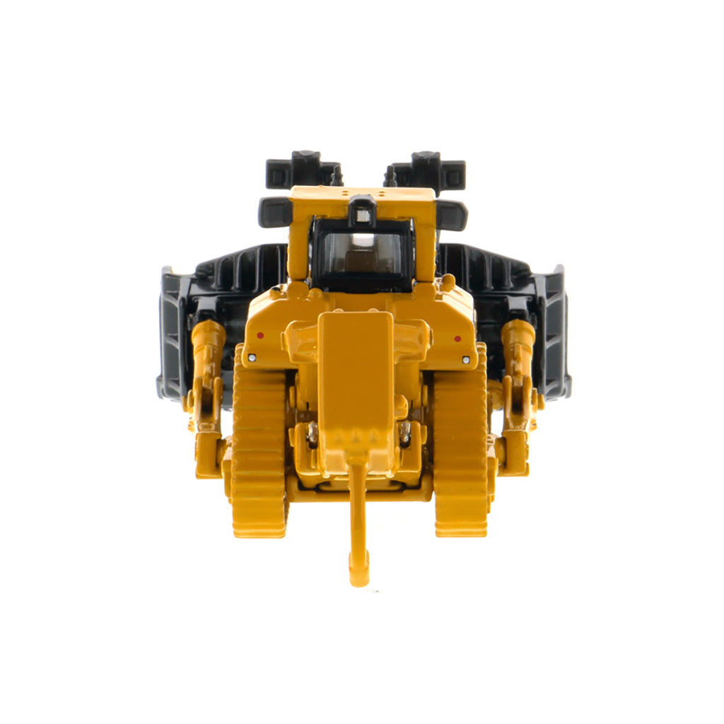 A yellow and black toy bulldozer model photographed from the back on a plain white background.