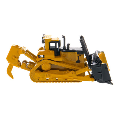 A yellow and black toy bulldozer model with a front blade and rear ripper attachment, photographed on a clean white background. The CAT logo is visible on the side.