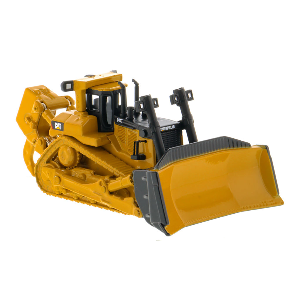 A yellow and black toy bulldozer model with a front blade and rear ripper attachment, photographed on a clean white background. The CAT logo is visible on the side.