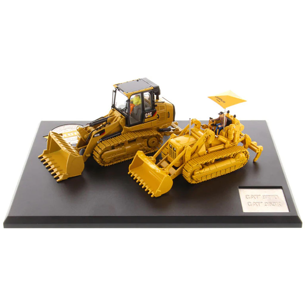 Two Caterpillar Track Loader Models on a Black Base and White Background