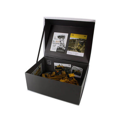 Two Caterpillar Track Loader Models in Their Open Box and White Background