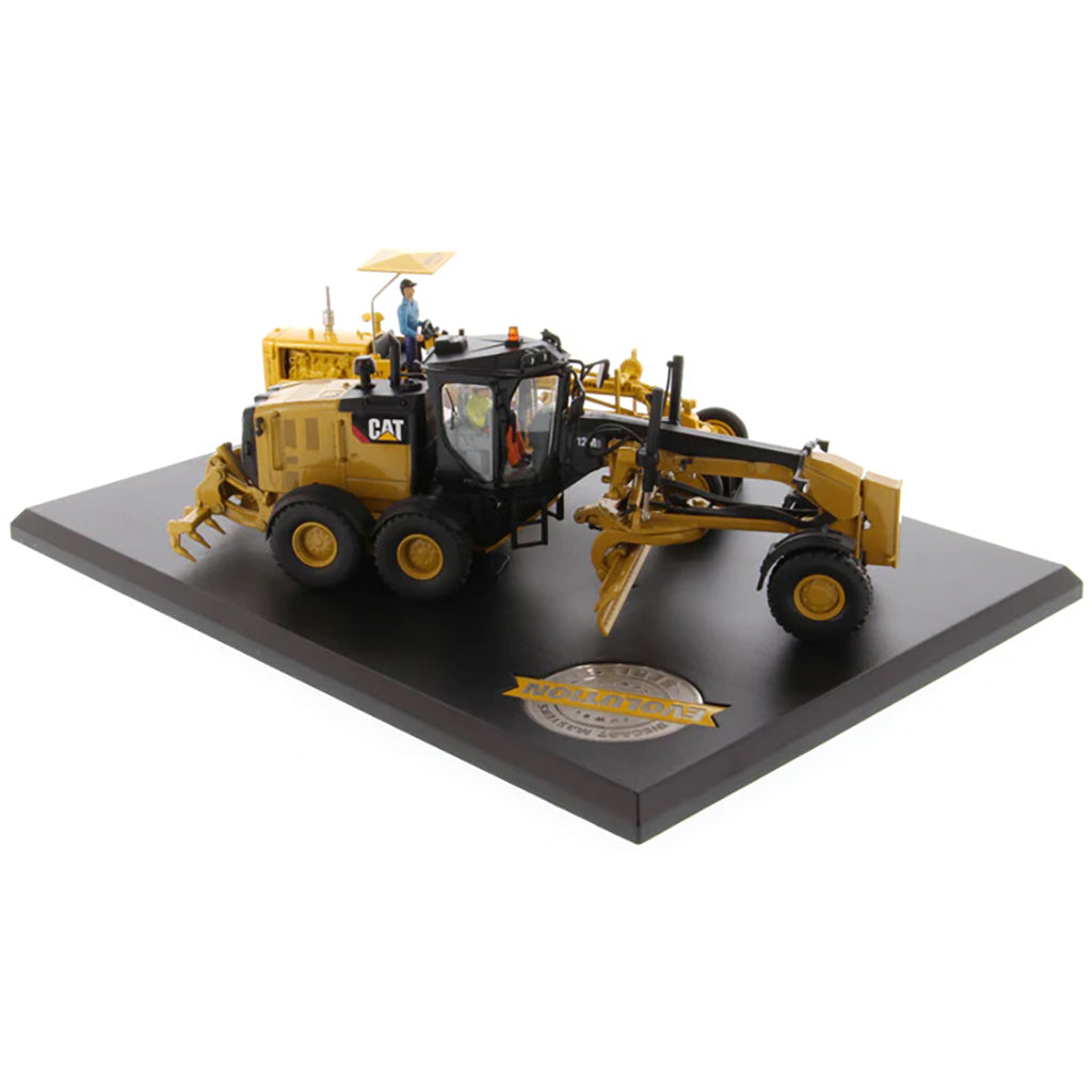 Models of 2 Different Caterpillar Road Graders, 1 Vintage Diesel No 12 Motor Grader and 1 Modern 12M3 Motor Grader Mounted to a Black Base on a White Background