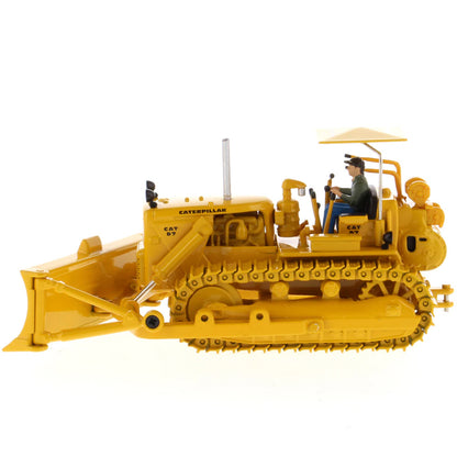 Model of a Vintage Yellow Caterpillar D7C Track-Type Dozer with Winch and Operator Figure on a White Background