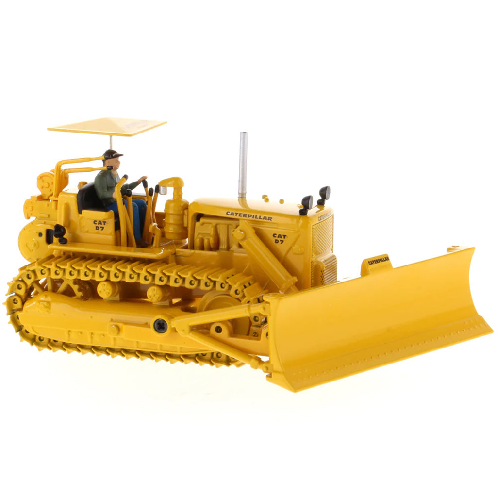 Model of a Vintage Yellow Caterpillar D7C Track-Type Dozer with Winch and Operator Figure on a White Background