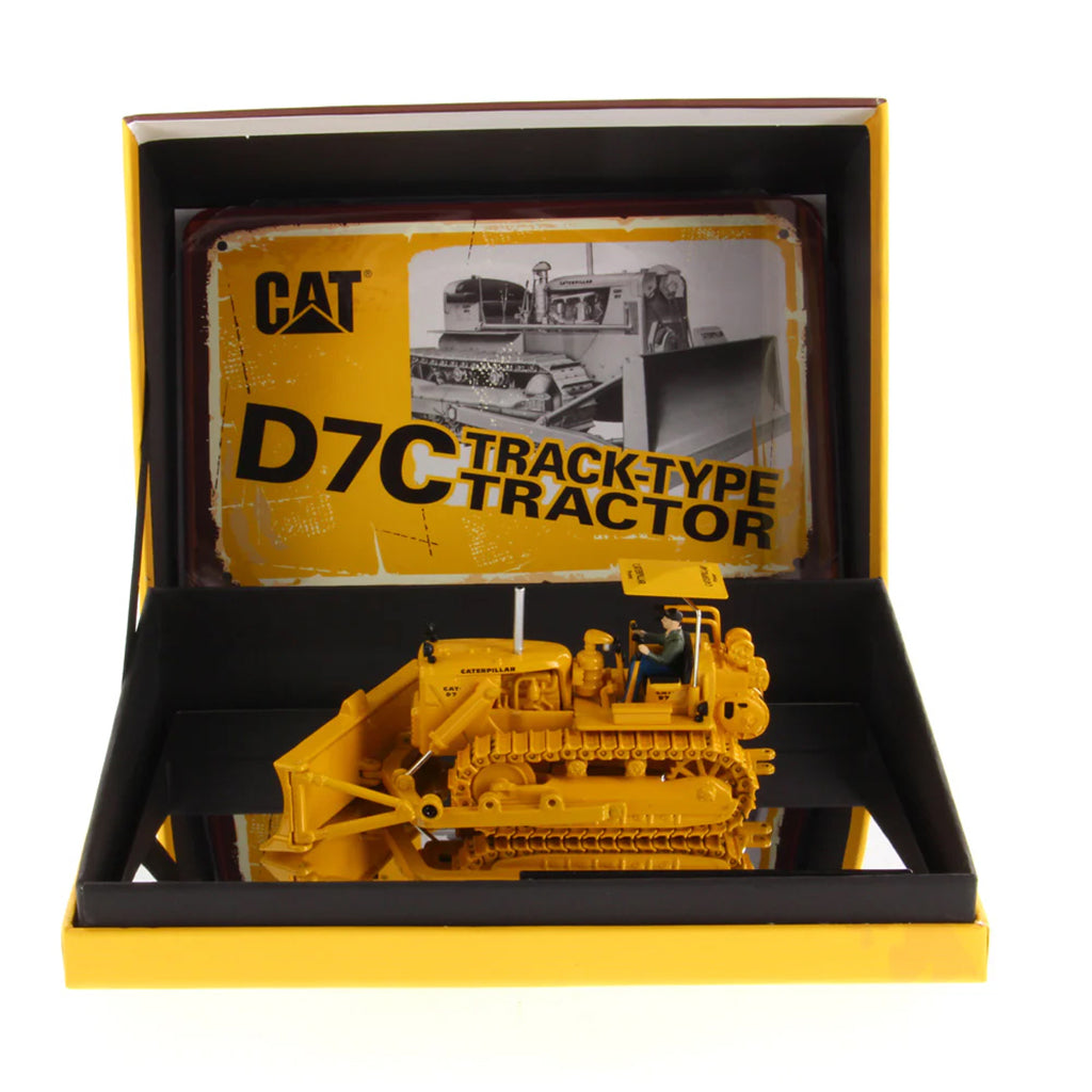 Model of a Caterpillar D7C track-type tractor in a display box with a yellow and black design.