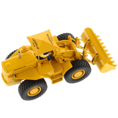 Model of a Yellow Caterpillar 966A Wheel Loader with Shade Umbrella on a White Background