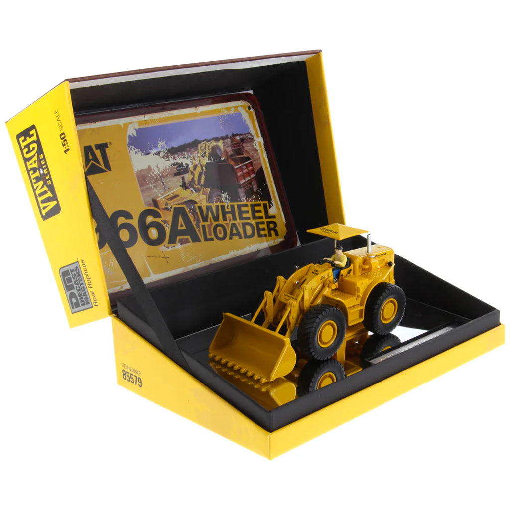 Model of a Yellow Caterpillar 966A Wheel Loader with Shade Umbrella on a White Background