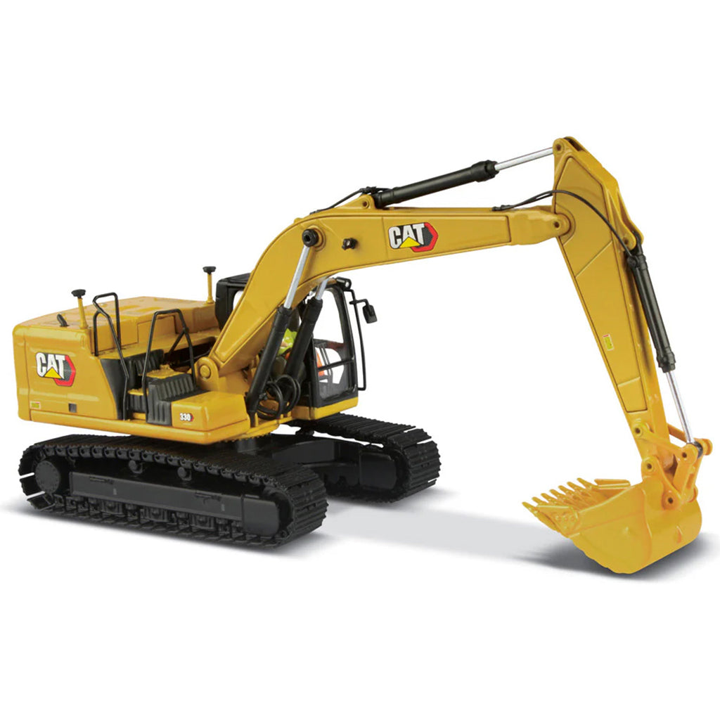Yellow toy excavator with Caterpillar logo on a white background