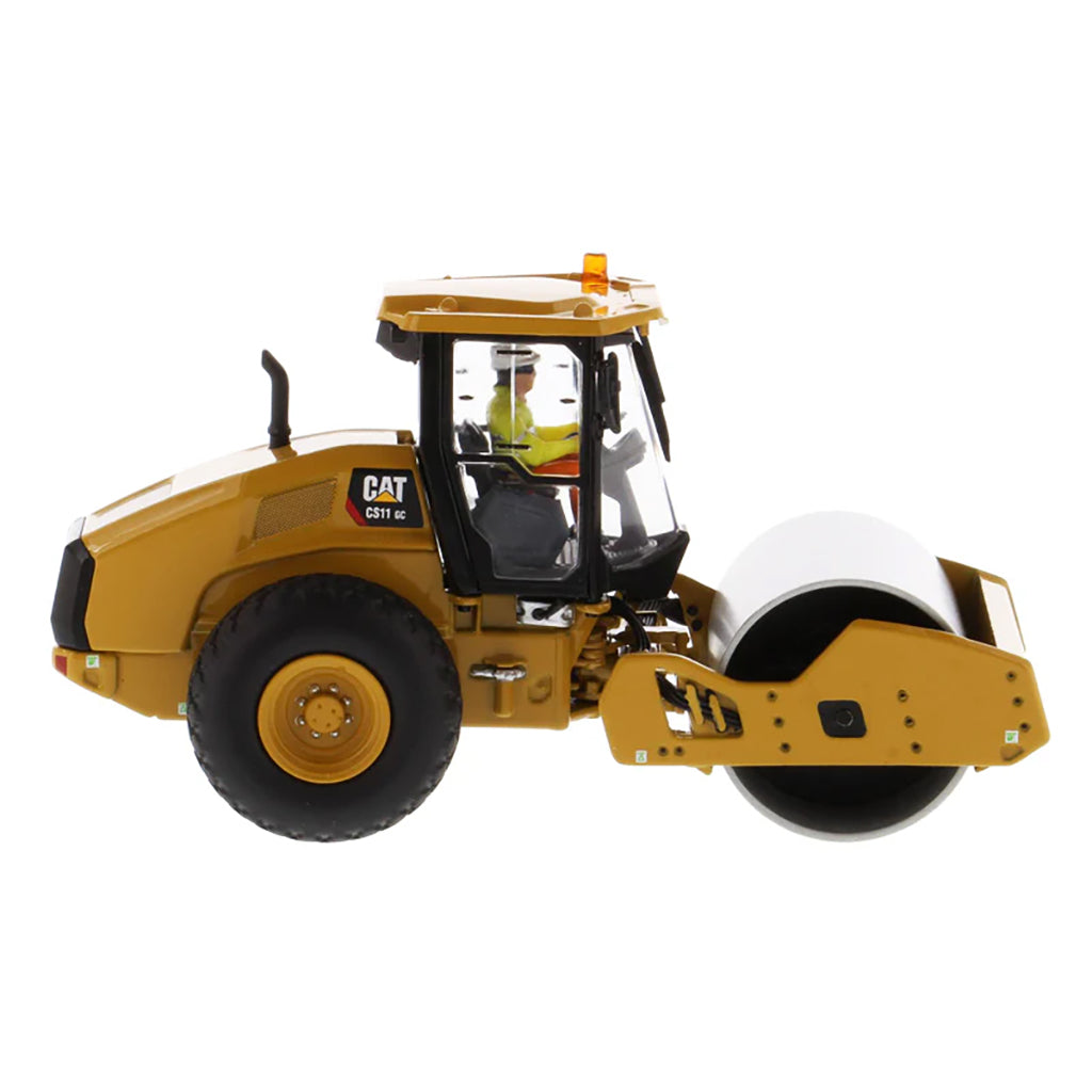 Model of a Caterpillar CS11 GC Smooth Drum Vibratory Soil Compactor w/Enclosed Cab on a White Background