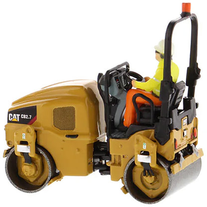 Model of a Caterpillar CB-2.7 Tandem Vibratory Road Roller with Operator on a White Background 