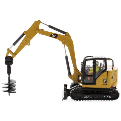 Model of a Caterpillar 308 CR Mini Hydraulic Excavator with Operator on a White Background