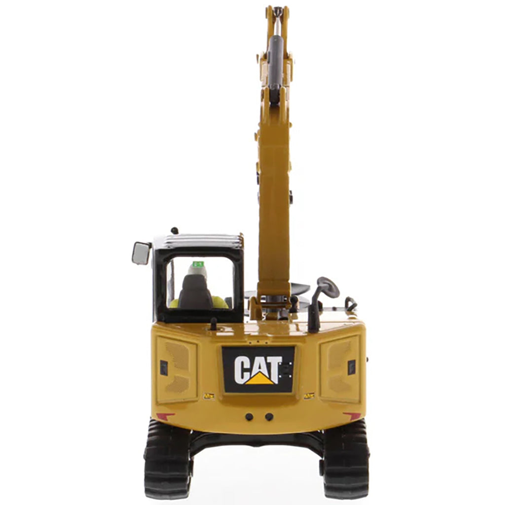 Model of a Caterpillar 308 CR Mini Hydraulic Excavator with Operator on a White Background