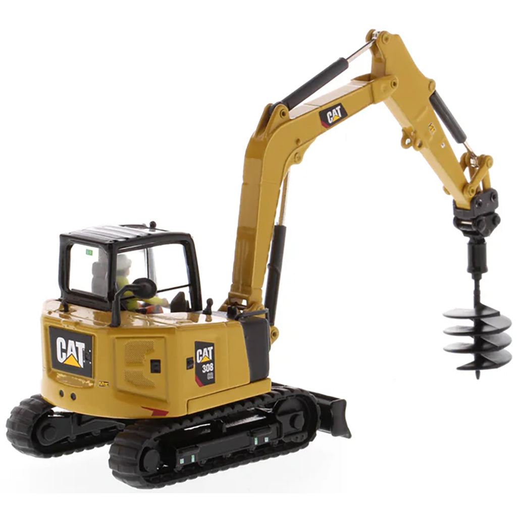 Model of a Caterpillar 308 CR Mini Hydraulic Excavator with Operator on a White Background