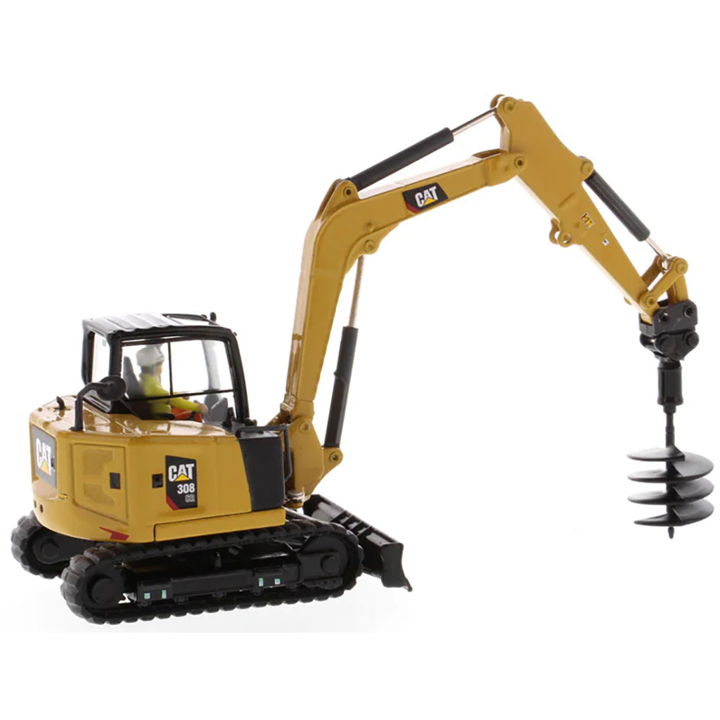 Model of a Caterpillar 308 CR Mini Hydraulic Excavator with Operator on a White Background