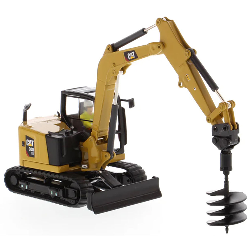Model of a Caterpillar 308 CR Mini Hydraulic Excavator with Operator on a White Background