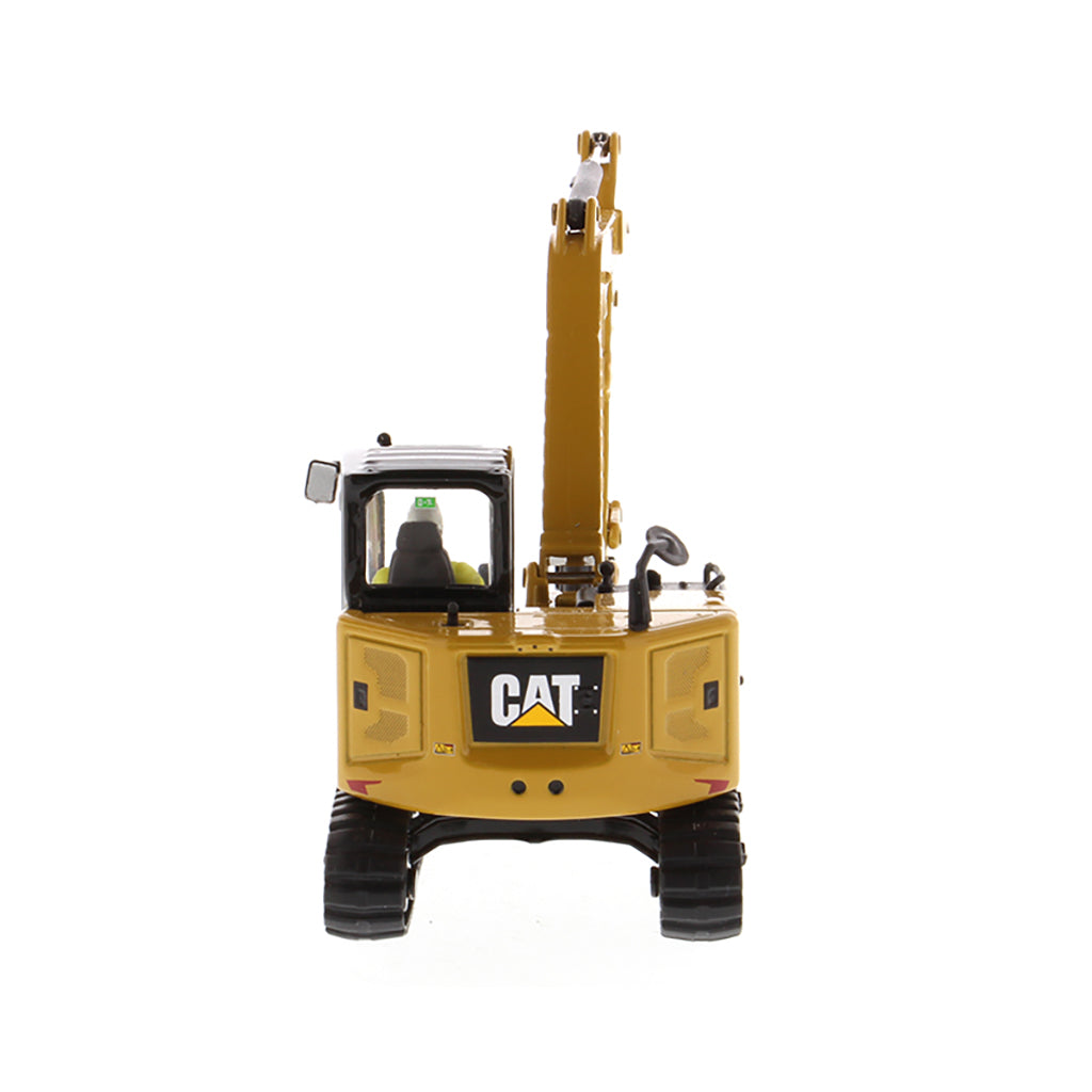 Model of a Caterpillar 308 CR Mini Hydraulic Excavator with Operator on a White Background
