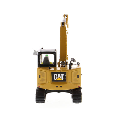 Model of a Caterpillar 308 CR Mini Hydraulic Excavator with Operator on a White Background