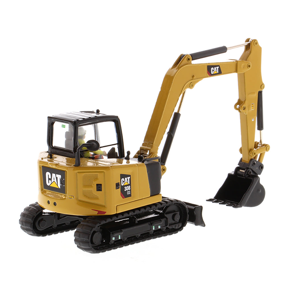 Model of a Caterpillar 308 CR Mini Hydraulic Excavator with Operator on a White Background