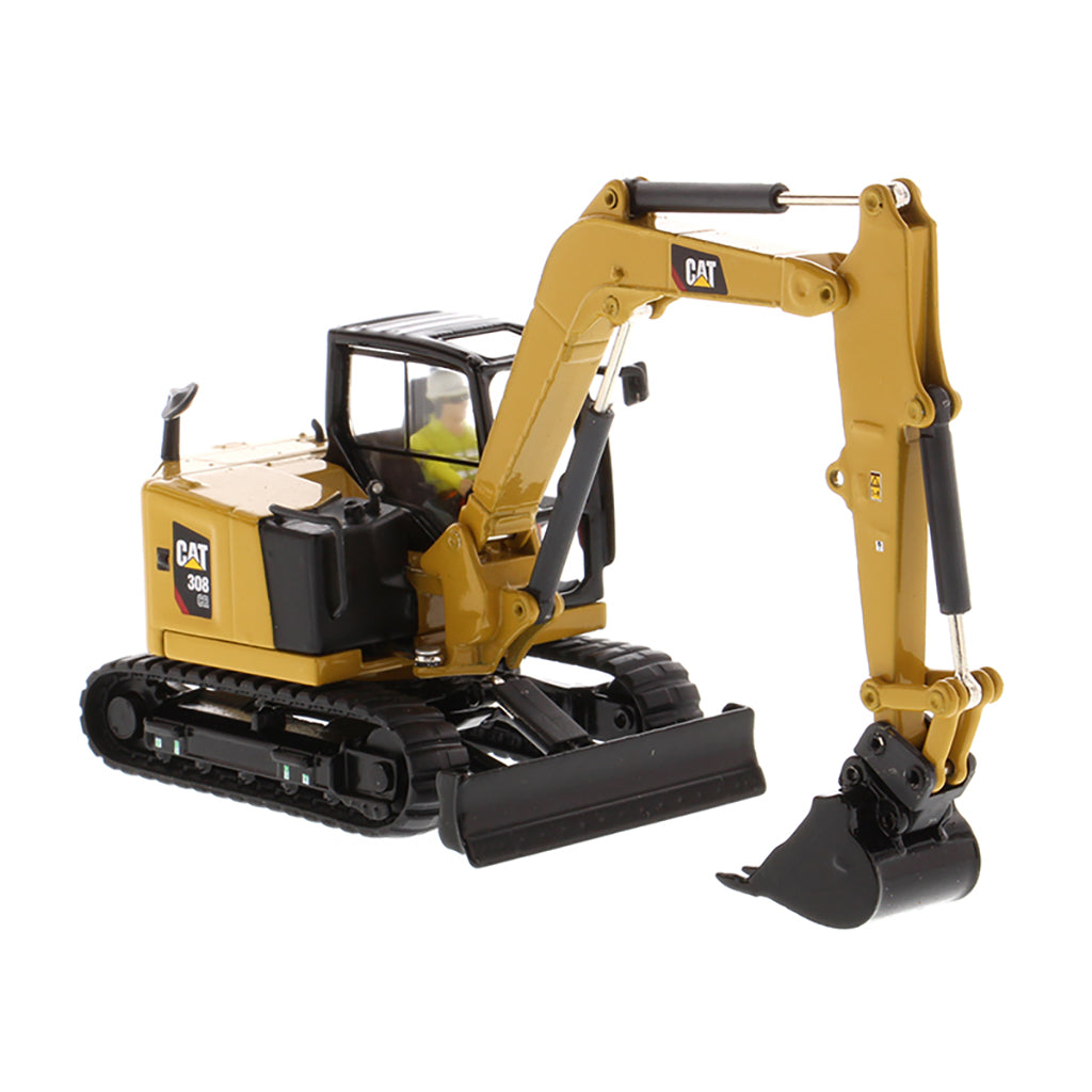 Model of a Caterpillar 308 CR Mini Hydraulic Excavator with Operator on a White Background