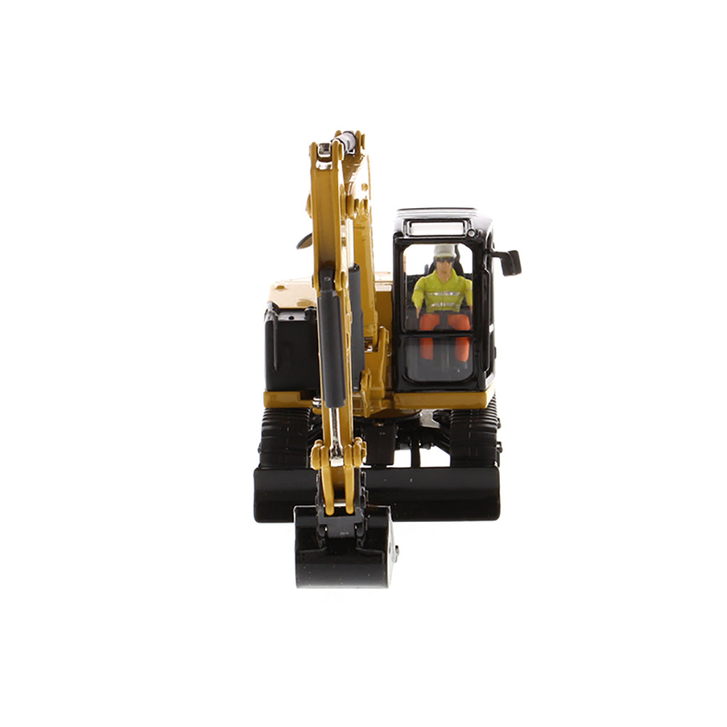 Model of a Caterpillar 308 CR Mini Hydraulic Excavator with Operator on a White Background