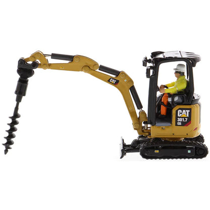 Model of a Next Generation Design Caterpillar 301.7 CR Mini Hydraulic Excavator with Operator on a White Background