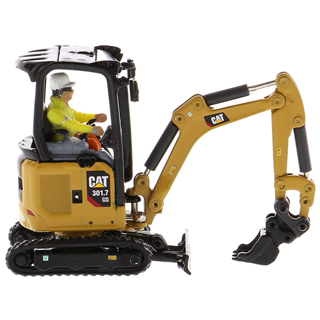 Model of a Next Generation Design Caterpillar 301.7 CR Mini Hydraulic Excavator with Operator on a White Background