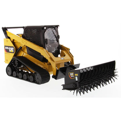 Model of a Caterpillar 297D2 Compact Track Loader with Wire Brush Attachment on a White Background