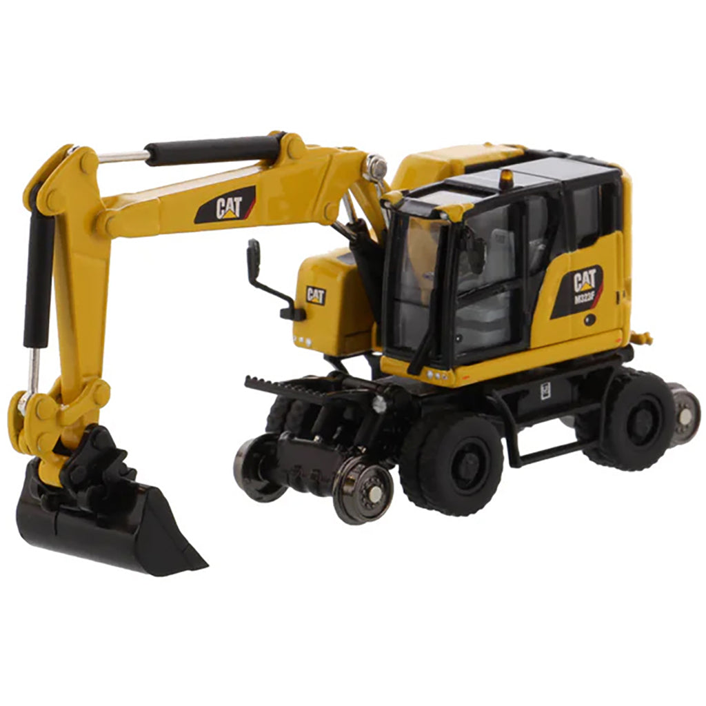 Model of a Safety Yellow Caterpillar M323F Railroad Wheeled Excavator on a White Background