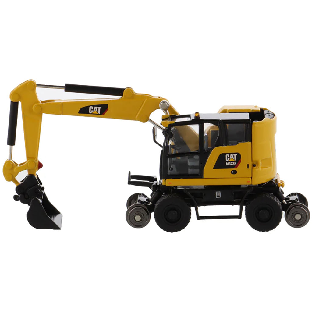 Model of a Safety Yellow Caterpillar M323F Railroad Wheeled Excavator on a White Background