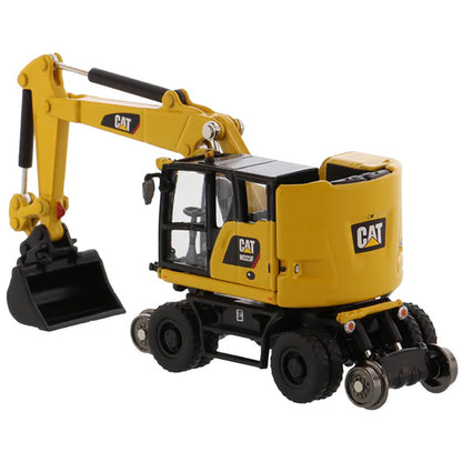 Model of a Safety Yellow Caterpillar M323F Railroad Wheeled Excavator on a White Background