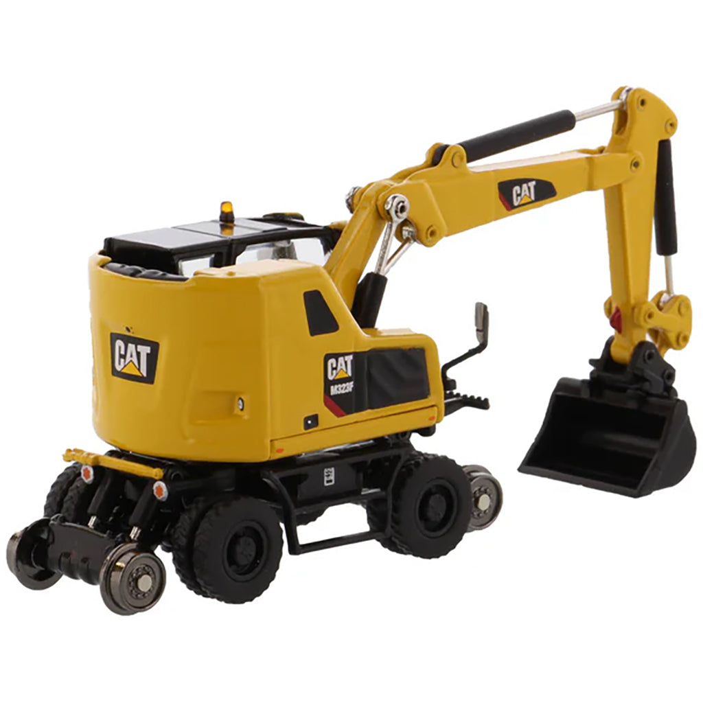 Model of a Safety Yellow Caterpillar M323F Railroad Wheeled Excavator on a White Background