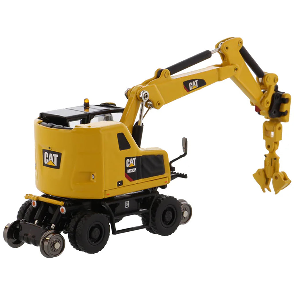 Model of a Safety Yellow Caterpillar M323F Railroad Wheeled Excavator on a White Background