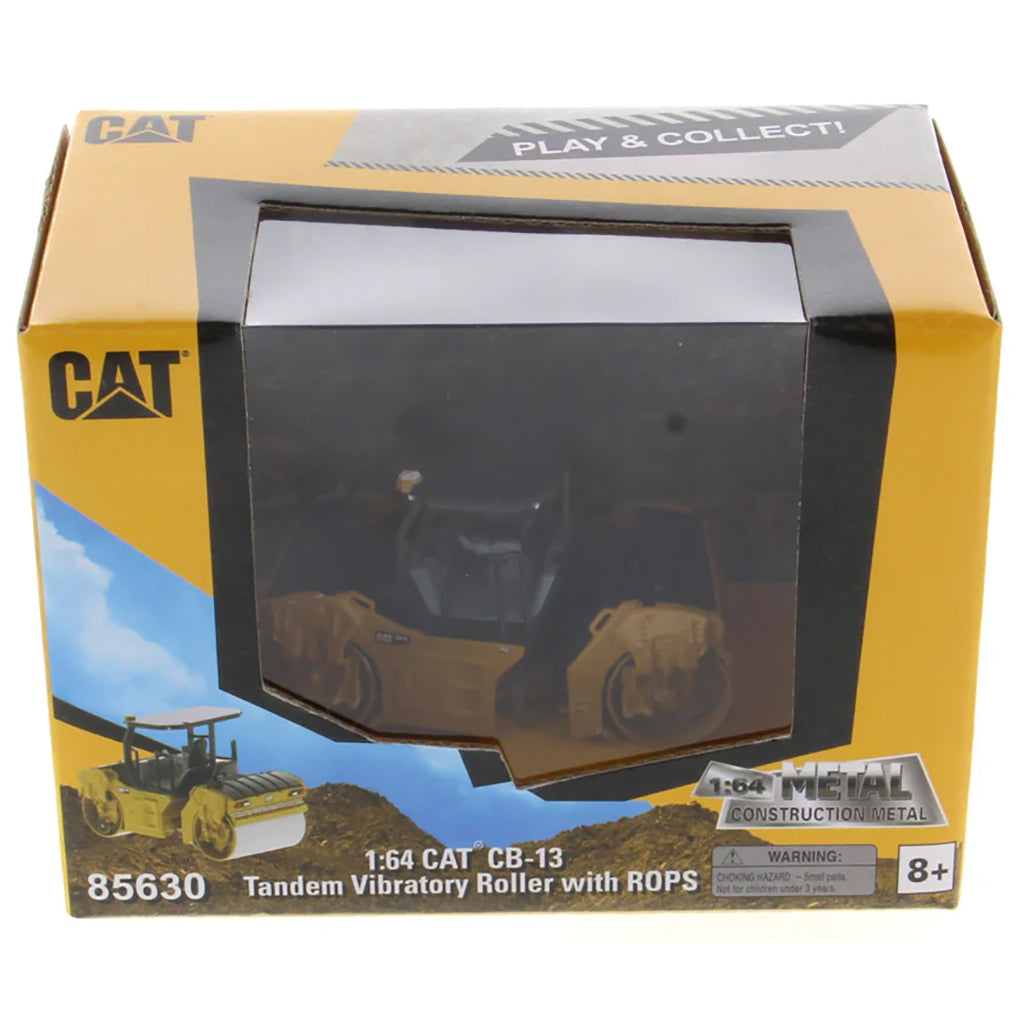 Boxed model of a CAT tandem vibratory roller with ROPS, featuring the CAT logo and product details.