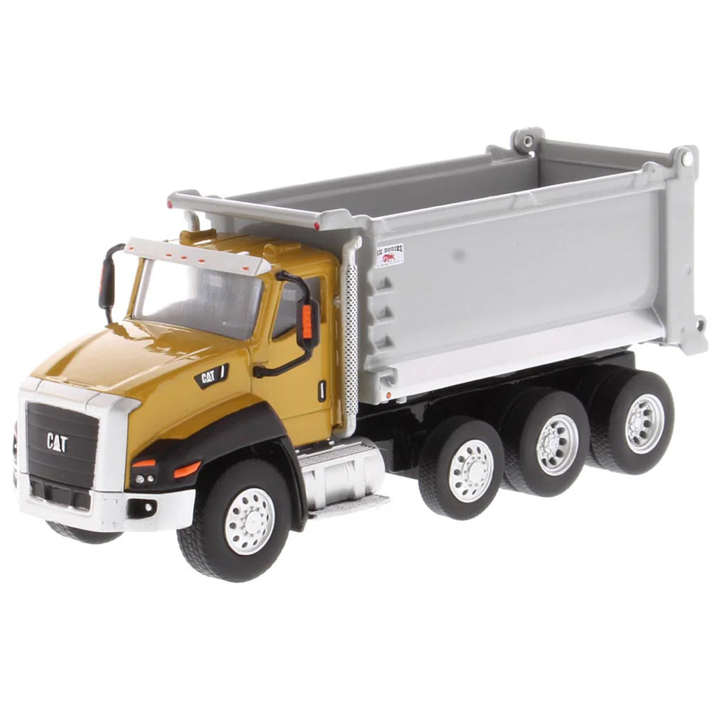 Model dump truck with yellow cab and gray bed on a white background