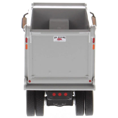 Gray dump trailer with visible brand logo on a white background