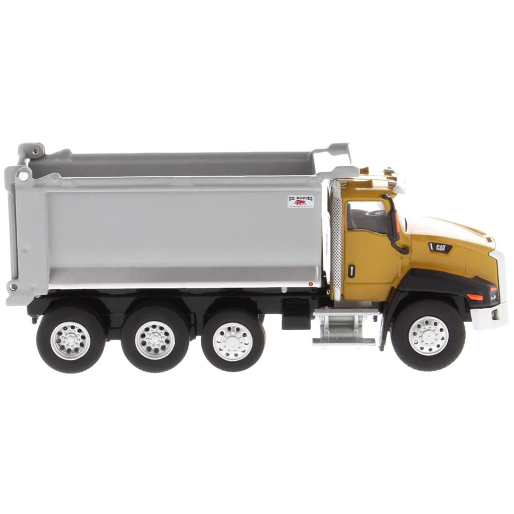 Model of a yellow dump truck with a gray bed on a white background