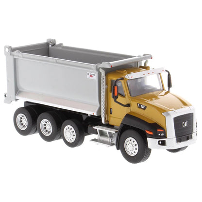 Model dump truck with yellow cab and gray bed on a white background