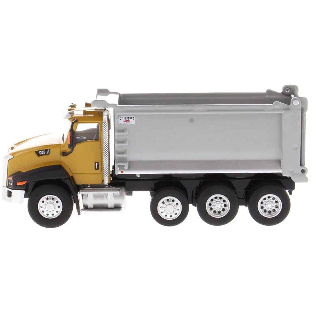 Model of a yellow dump truck with a gray bed on a white background