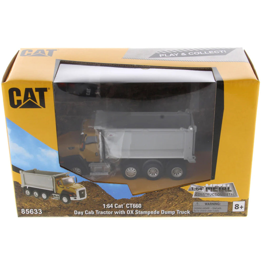 Boxed toy dump truck with CAT branding on a white background