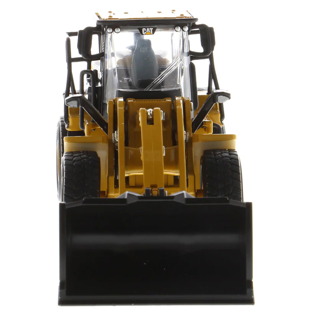 Model of a Caterpillar 950M Wheel Loader with Log Grappler and Longs on a White Background