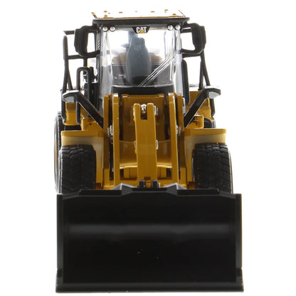 Model of a Caterpillar 950M Wheel Loader with Log Grappler and Longs on a White Background