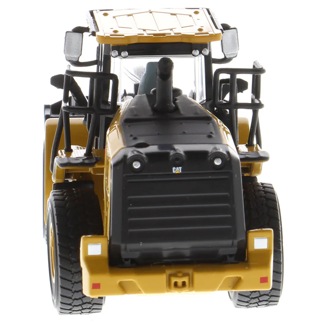 Model of a Caterpillar 950M Wheel Loader with Log Grappler and Longs on a White Background